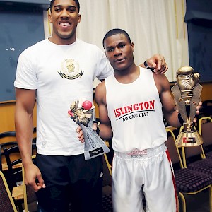 World heavy weight Champion Anthony Joshua handing out trophys at boxing open show